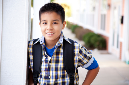 Boy with backpack in buttondown